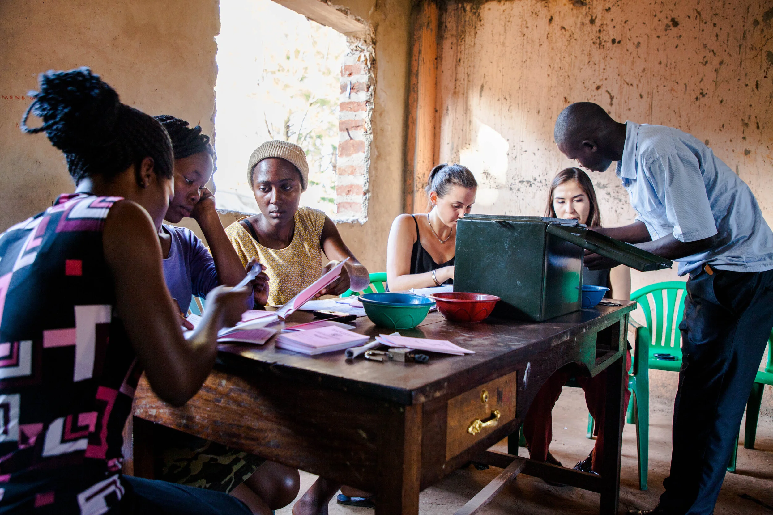 Community leader meeting families in a village